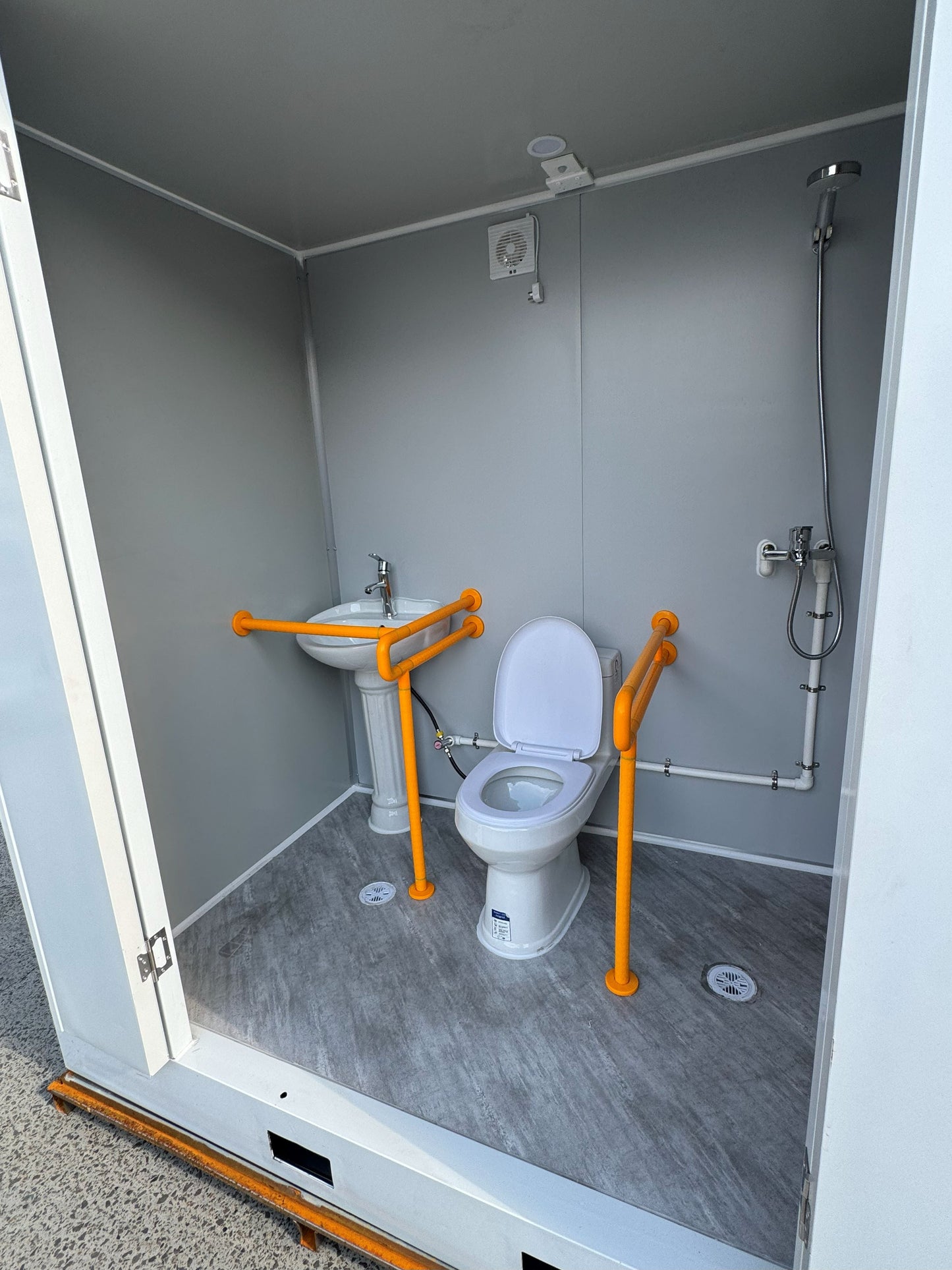 Premium Plumbed-In disability-friendly Portable Toilet With Shower Unit with WPC Fluted Wall Cladding – Fully Built & Ready to Use